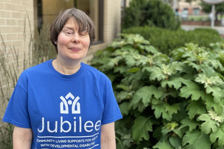 Woman standing outside wearing Jubilee t-shirt